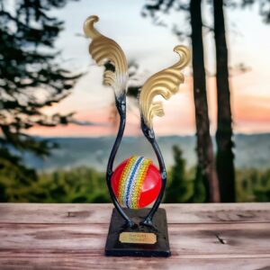 Custom gold, black and red cremation urn with a band of multicolored Swarovski crystals