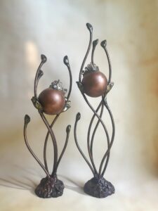 two tall cremation urns for pets with crowns